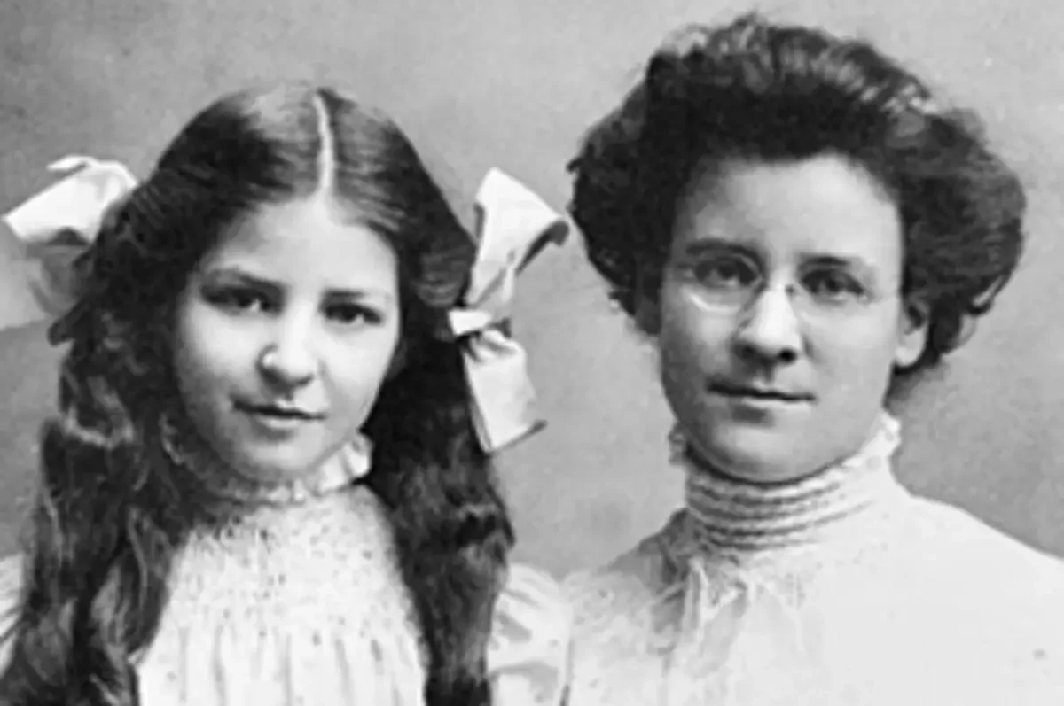 Black-and-white archival portrait of Isabel Briggs Myers on the left as a young girl and her mother, Katharine Cook Briggs, on the right wearing glasses