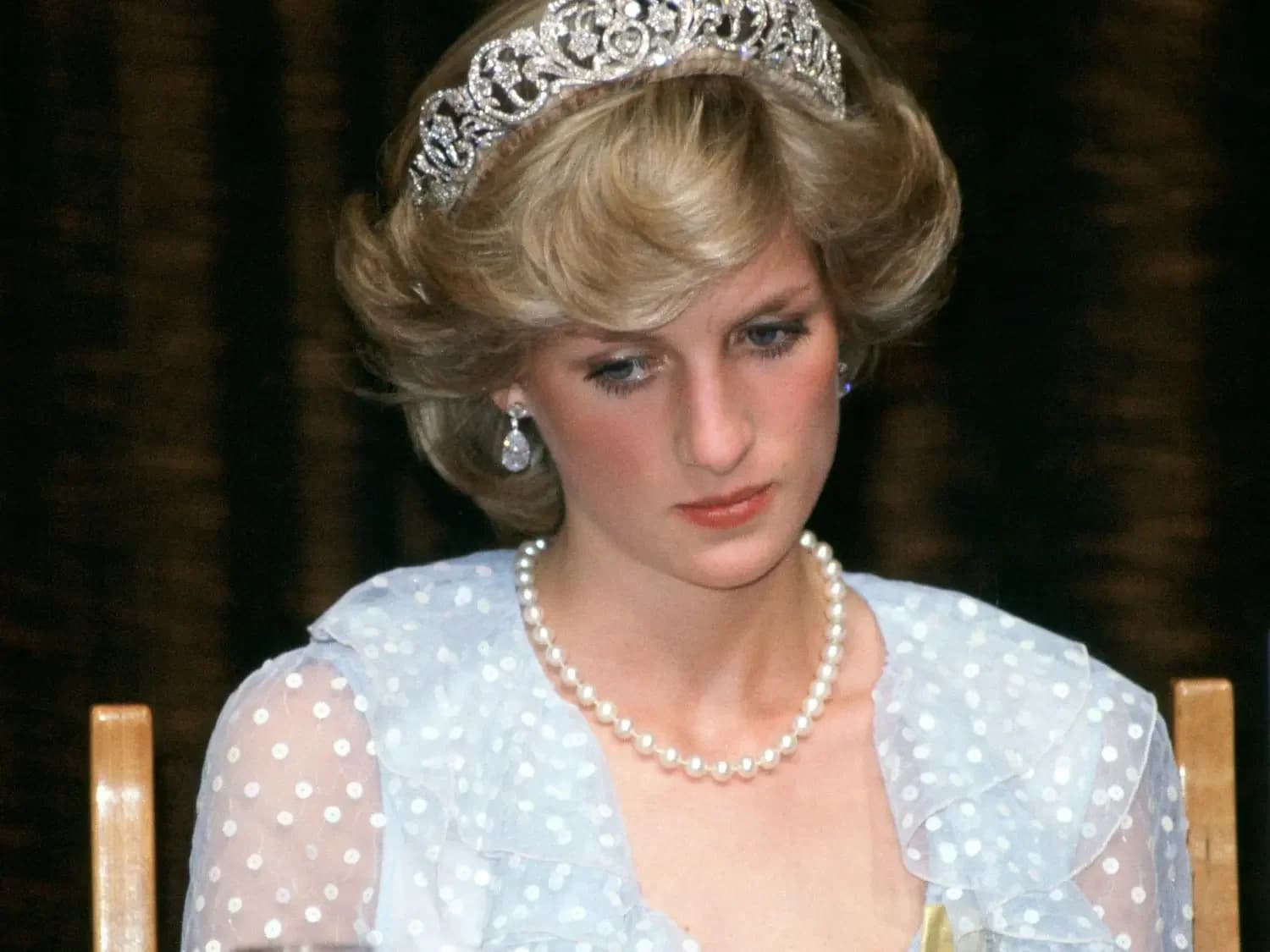 Lady Diana Spencer looking pensive and wearing a tiara