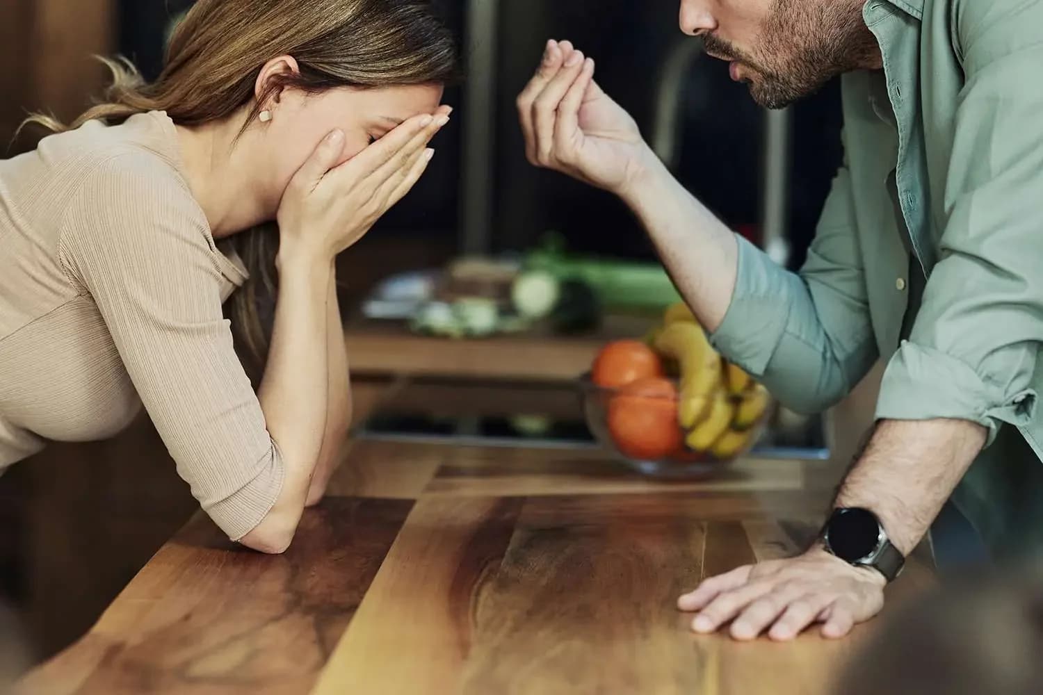 A couple arguing over a table